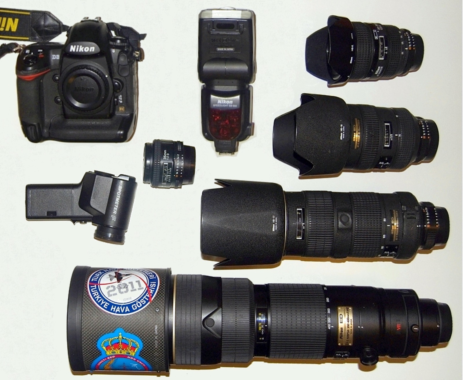 A workbench of film cameras and rolls